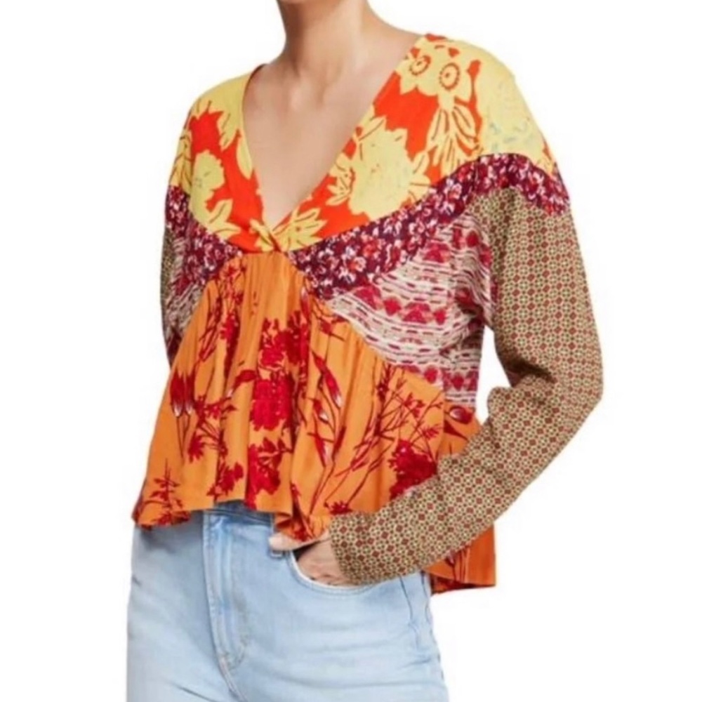 Free People long sleeve top with floral multi-pattern design. Deep V cut.